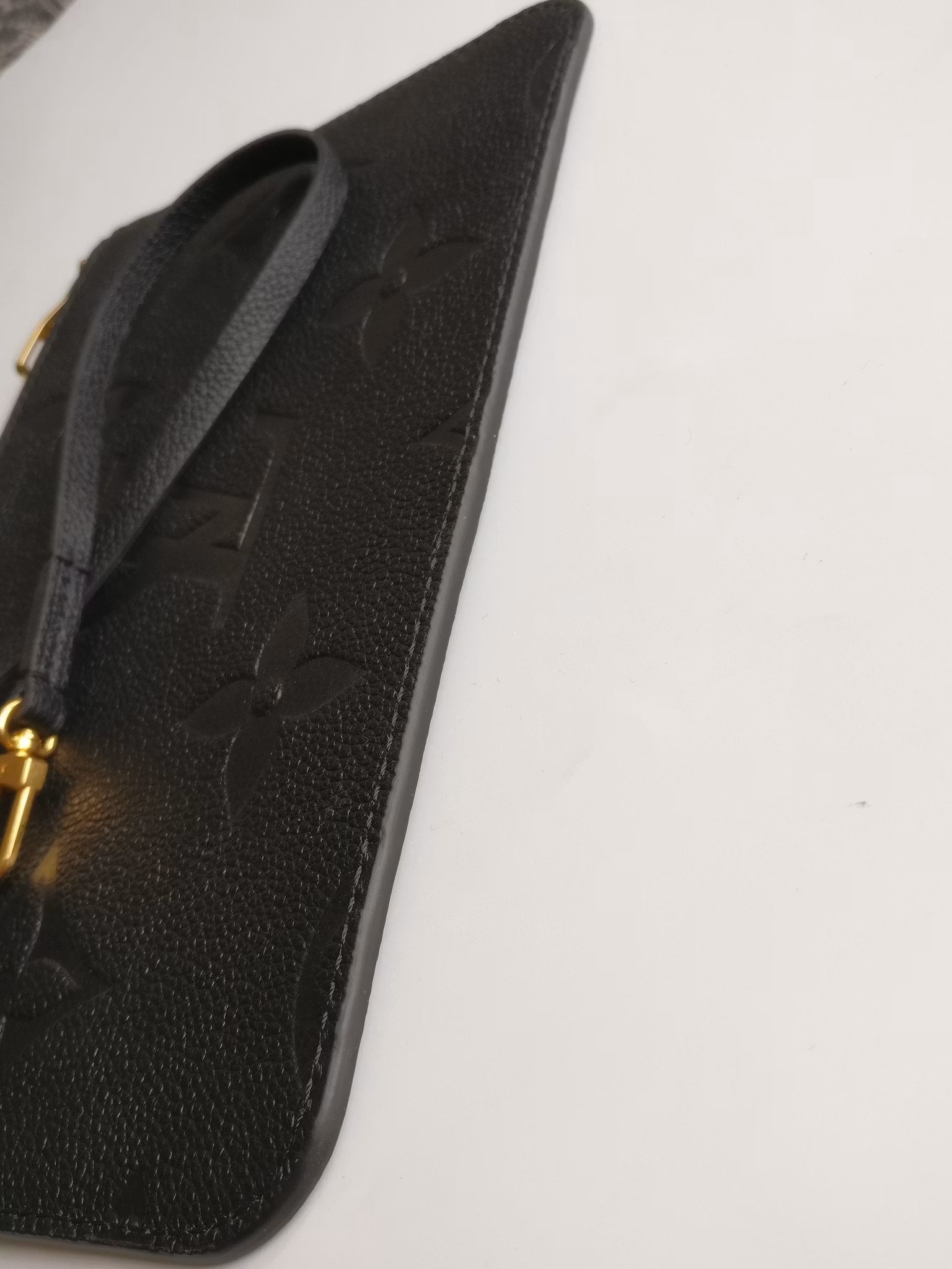 Louis Vuitton Neverfull empreinte clutch