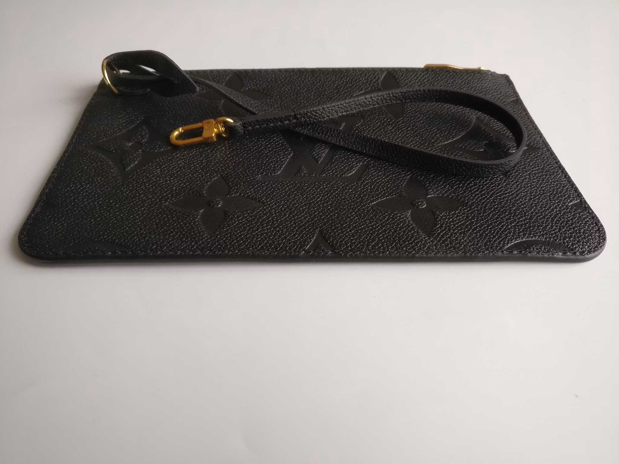 Louis Vuitton Neverfull empreinte clutch