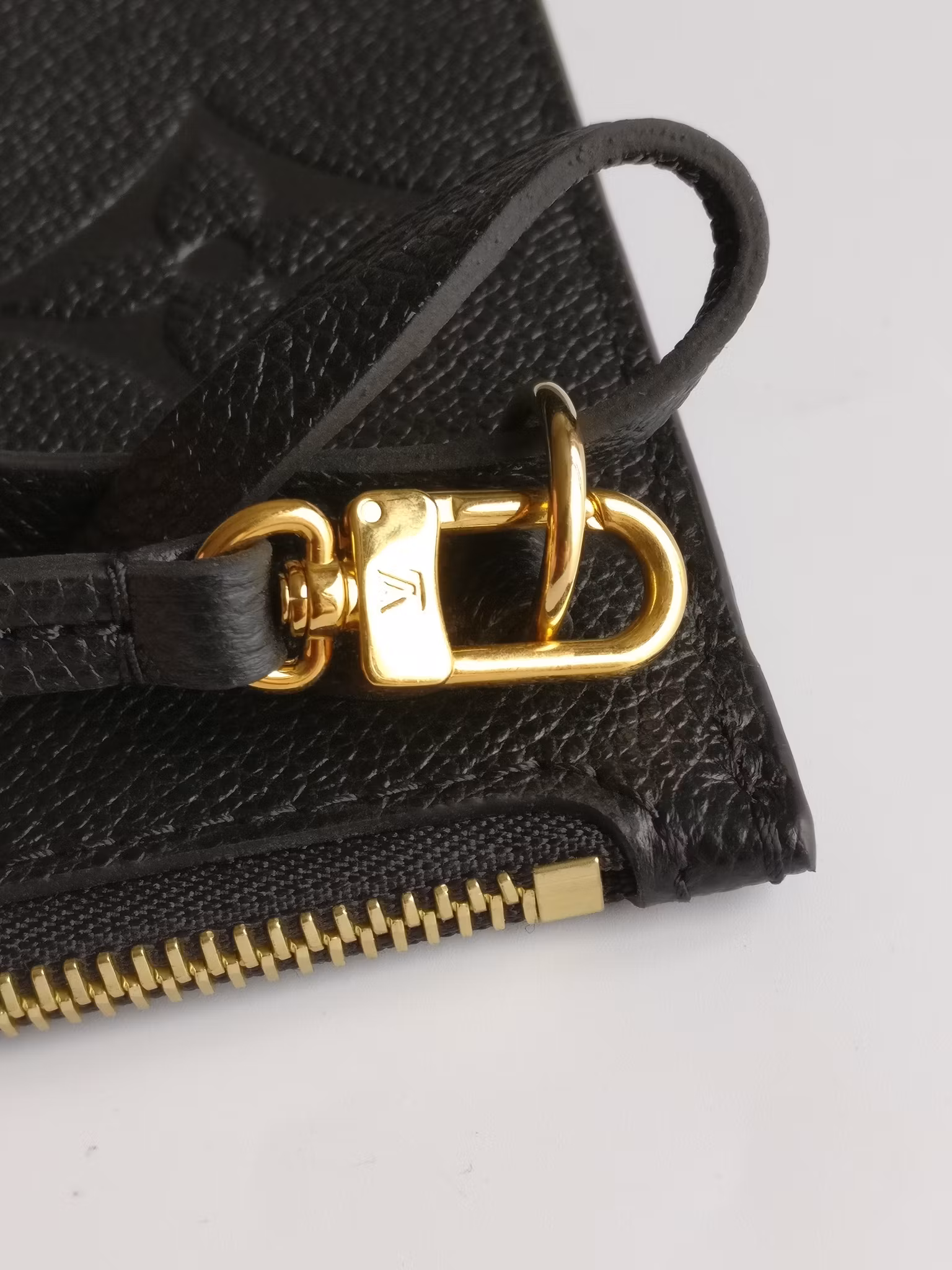 Louis Vuitton Neverfull empreinte clutch