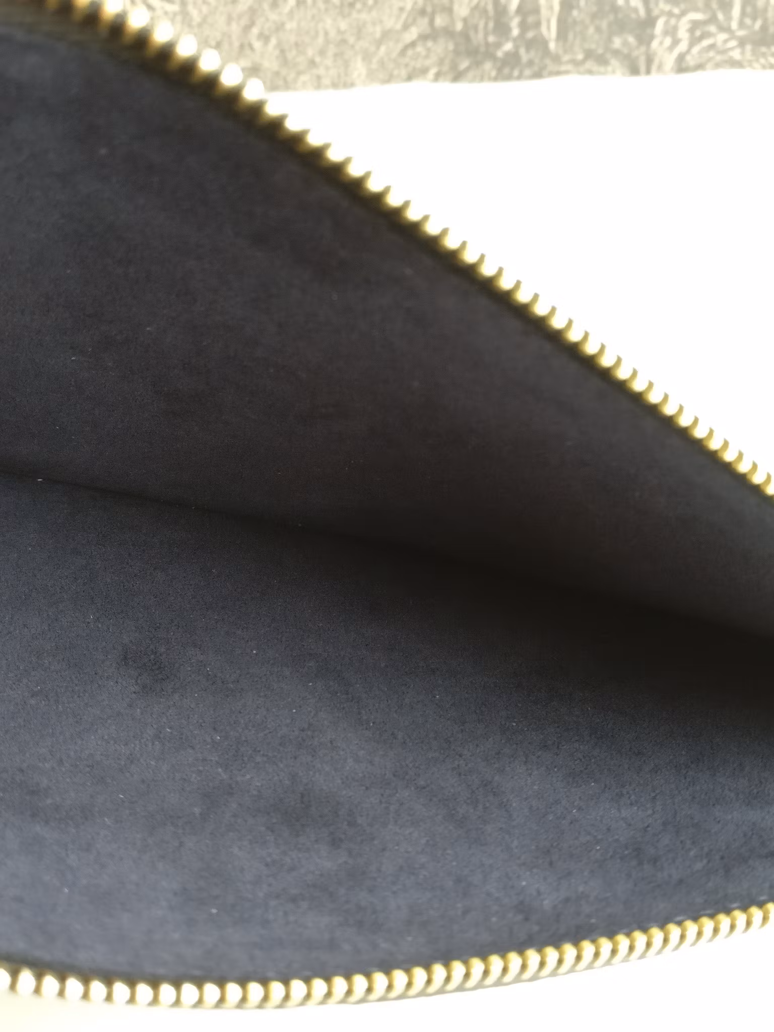 Louis Vuitton Neverfull empreinte clutch