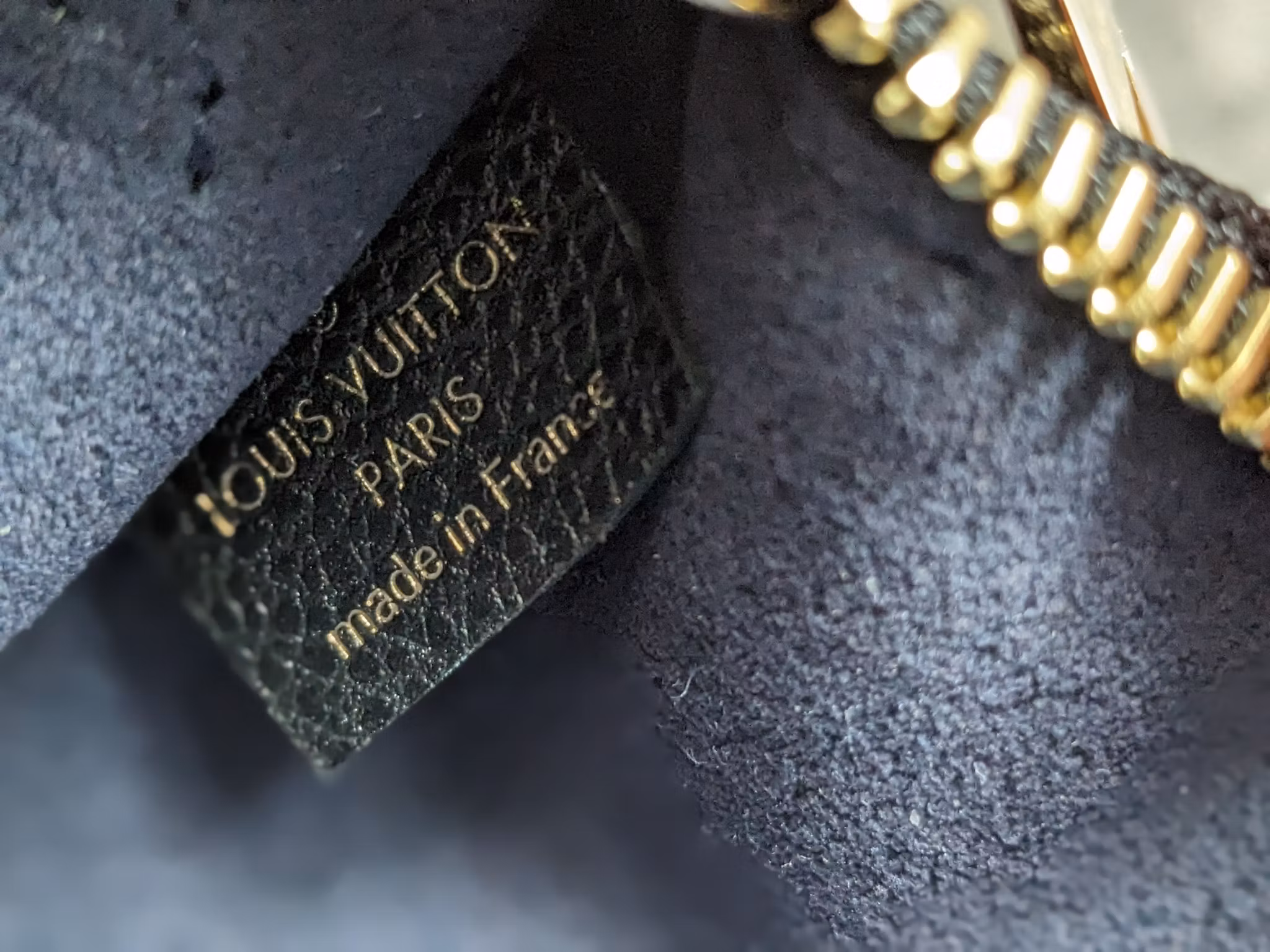 Louis Vuitton Neverfull empreinte clutch