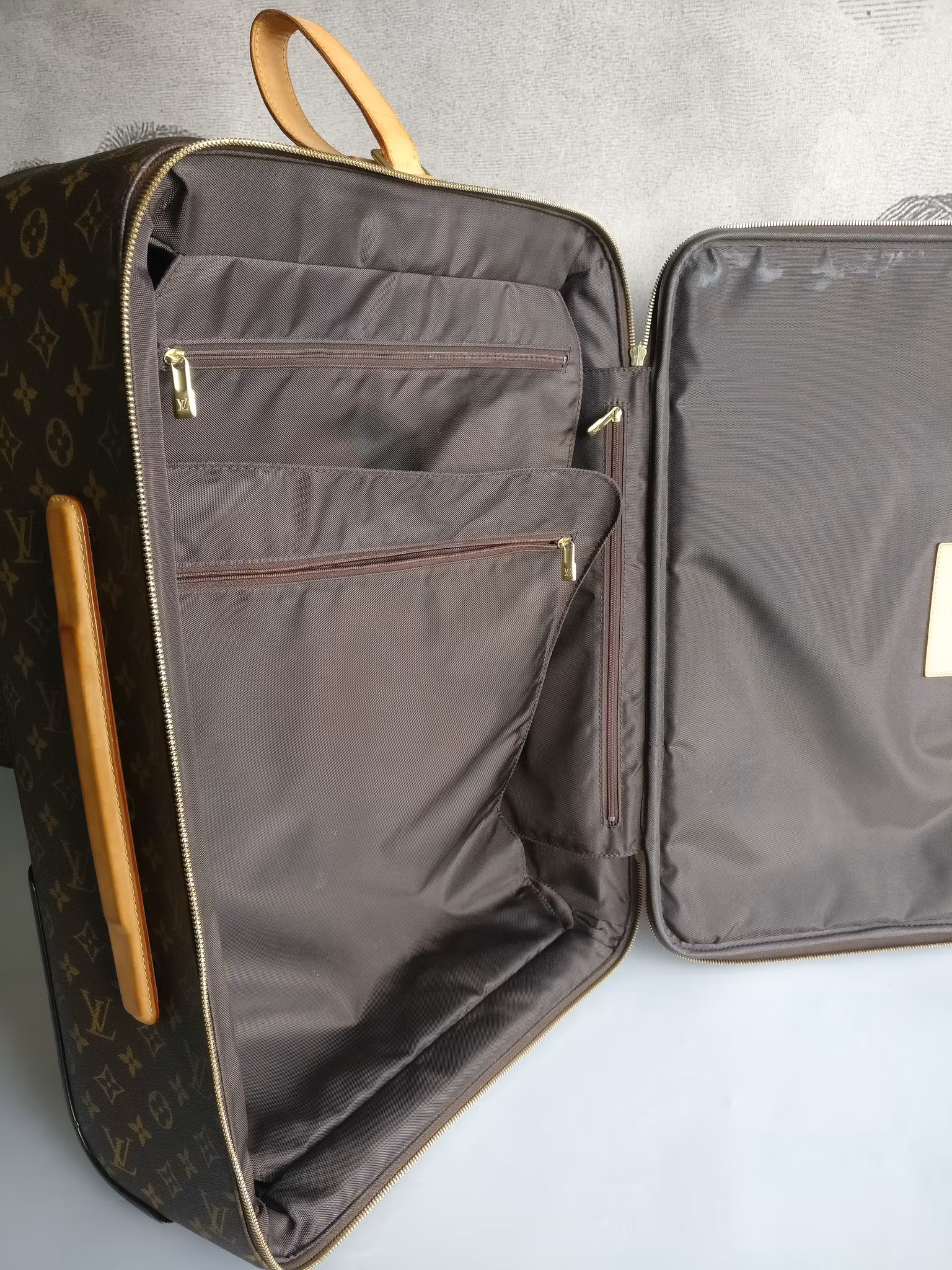 Louis Vuitton Pegase 55 with bag cover