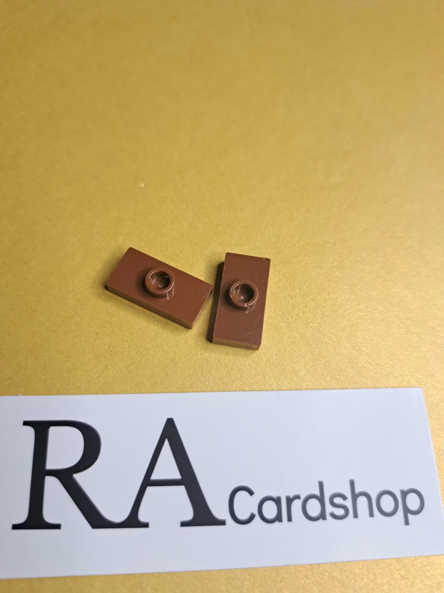 15573 Plate, Modified 1 x 2 with 1 Stud with Groove and Bottom Stud Holder (Jumper) Brown Lego