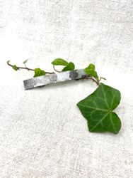 Kamouflage-mönstrad hårklämma i läder. Flera alternativ