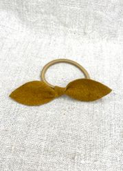 Currygul läderrosett-gummiband