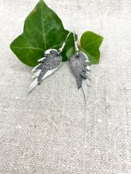 Dubbel "Änglavingar", mellan + liten. Silver och Svart-glittrig