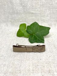 Hårklämma, liten med antikguldig läderrosett