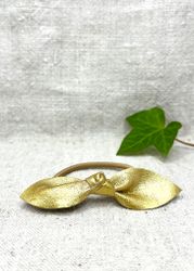 Guldig läderrosett-gummiband