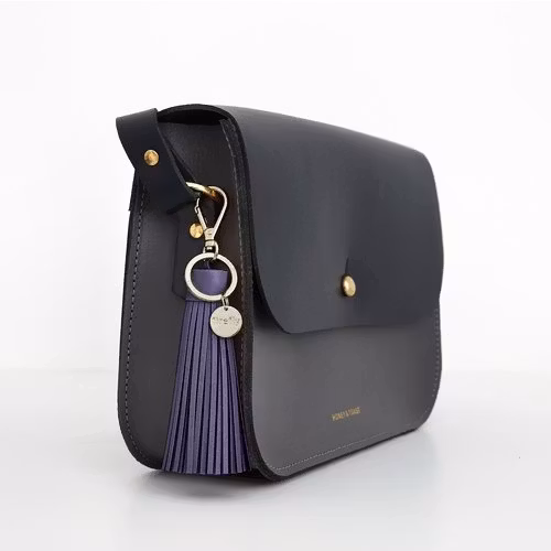 Firefly reflector soft tassel lila på väska