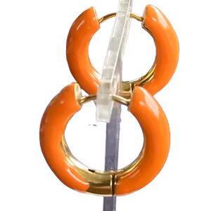 Fina Oranga örhängen Med Gulddetaljer By Odahl!