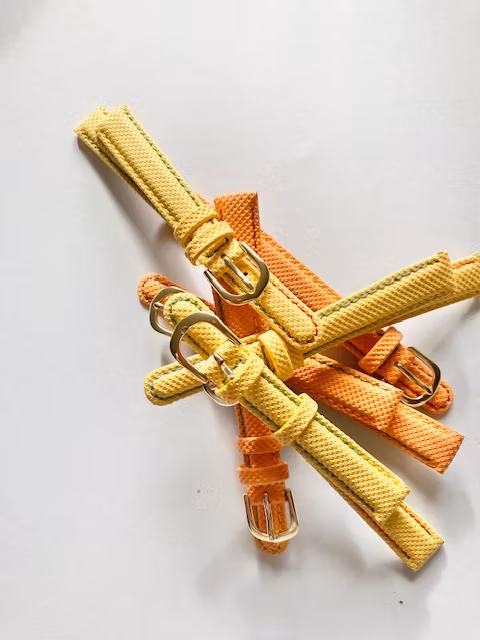 Barnklockarmband Material Textil med läderfodring 12 mm Bredd. Färg Gul eller orange