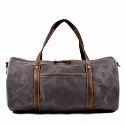 Duffelbag vaxad canvas, slitstark och tål väta.