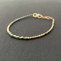 TURKOS ARMBAND I MÄSSING