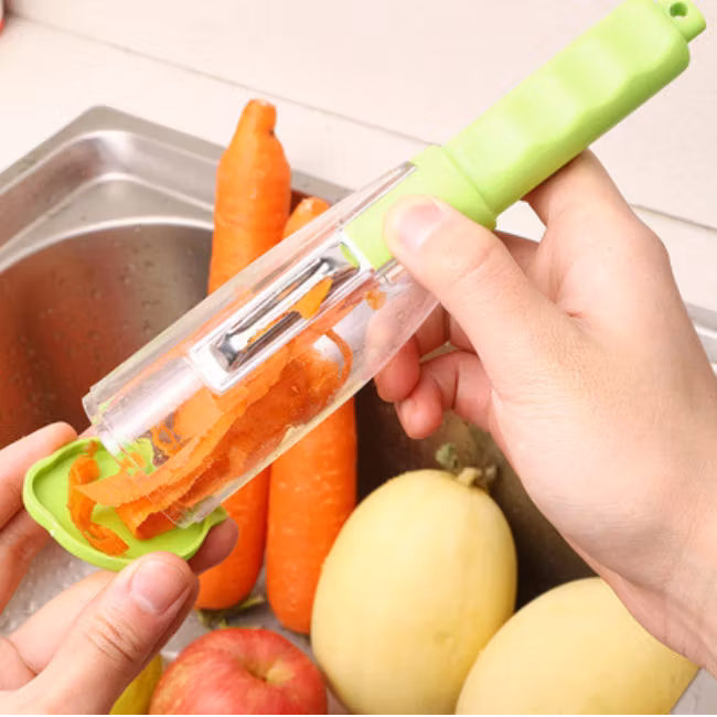 Frukt- och grönsaksskalare  metall knife med behållare