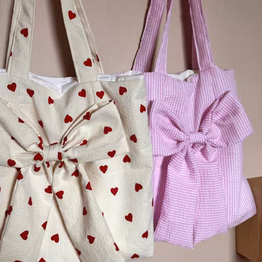 Handsydd tygpåse med rosett - designa själv