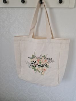 Tygkasse stor med Världens Bästa Mamma framför en blomma