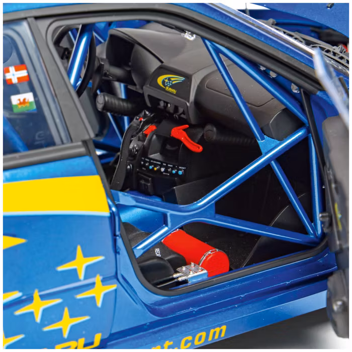 Vattenskadad låda - Skala 1/8 Subaru Impreza Solberg/Mills in metal, w light, etc. fr Ixo Collections - Di