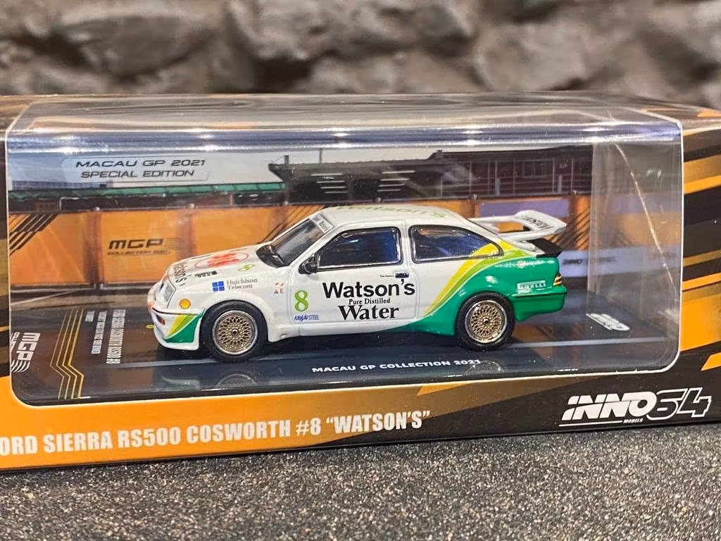 REA! Skala 1/64 Ford Sierra RS500 Cosworth, Macau GP Coll. 21' fr Inno64