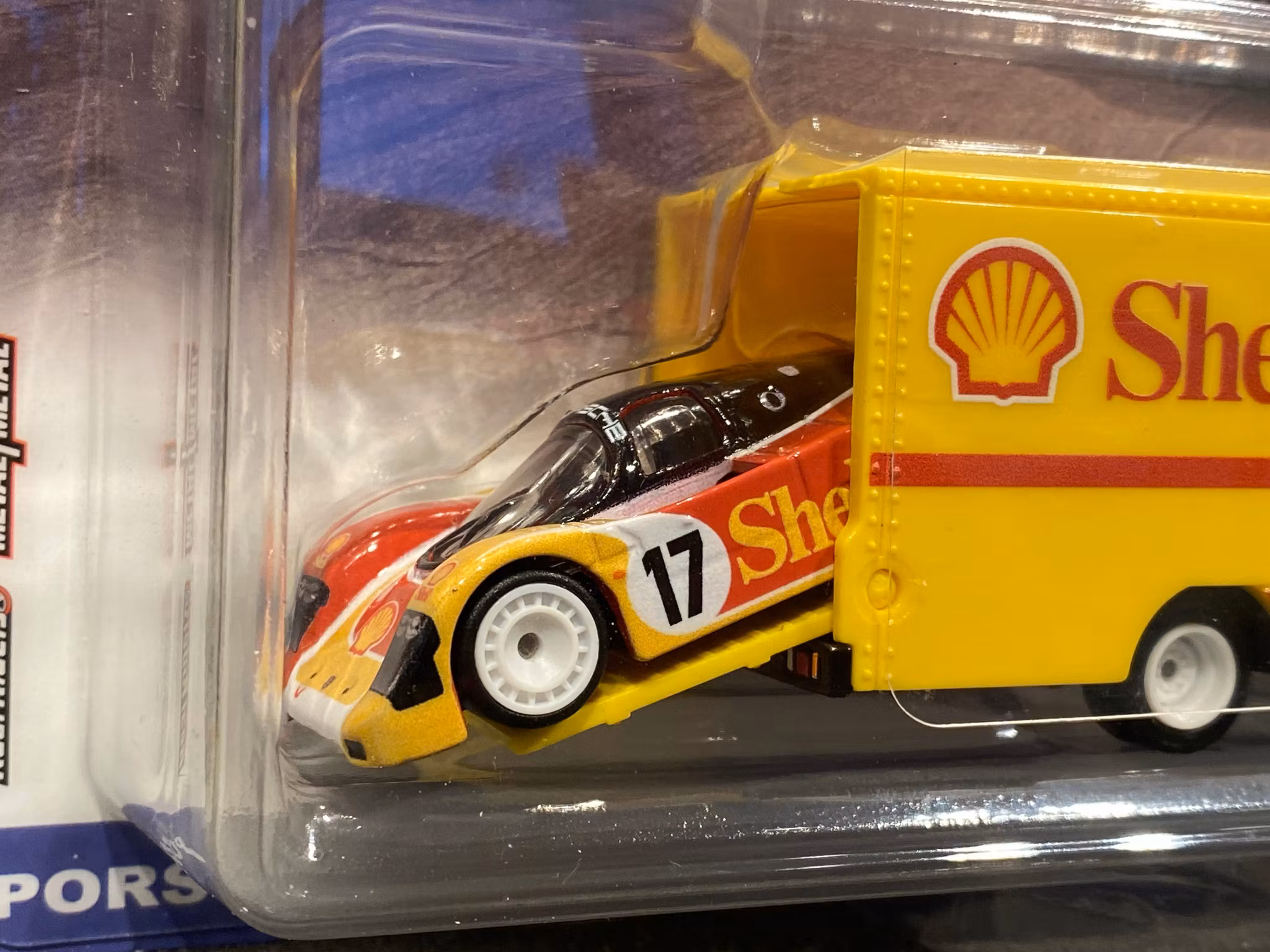 Skala 1/64 Hot Wheels PREMIUM Team Transport: Porsche 962 + Sakura Sprinter