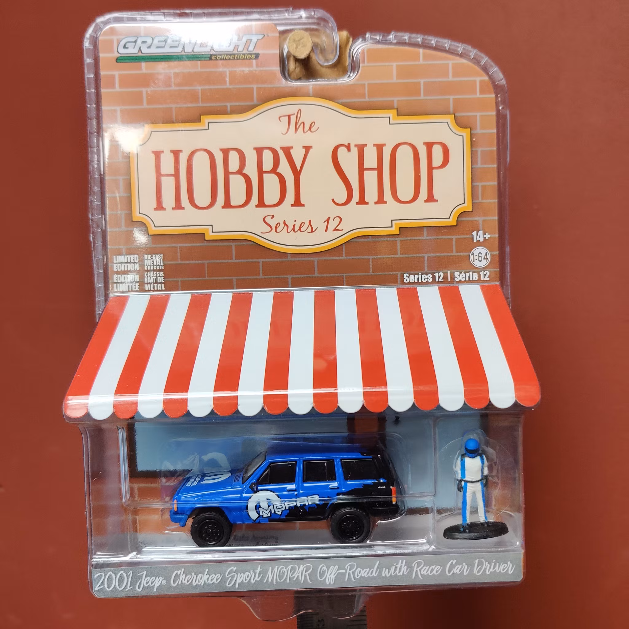 Skala 1/64 jeep Cherokee Sport Mopar Off-road "The hobby shop ser.12" från Greenlight