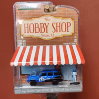 Skala 1/64 jeep Cherokee Sport Mopar Off-road "The hobby shop ser.12" från Greenlight