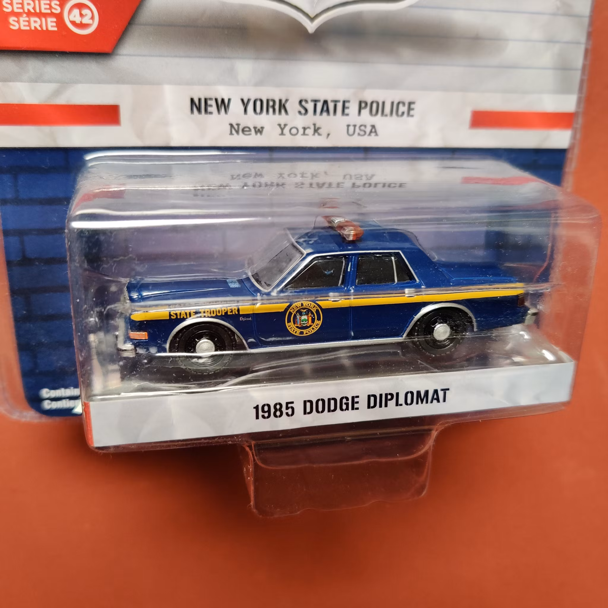 Skala 1/64 Dodge Diplomat 85' New York State Police "Hot Pursuit" från Greenlight