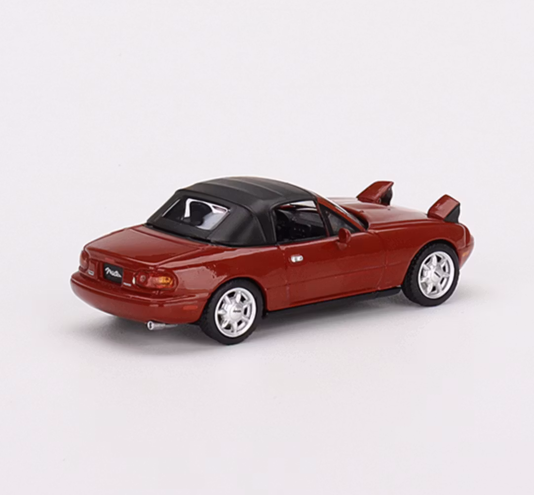 Skala 1/64 - Mazda Miata MX-5 (NA) röd, Uppfälld softtop & Ljus Vä styrd, fr MINI GT