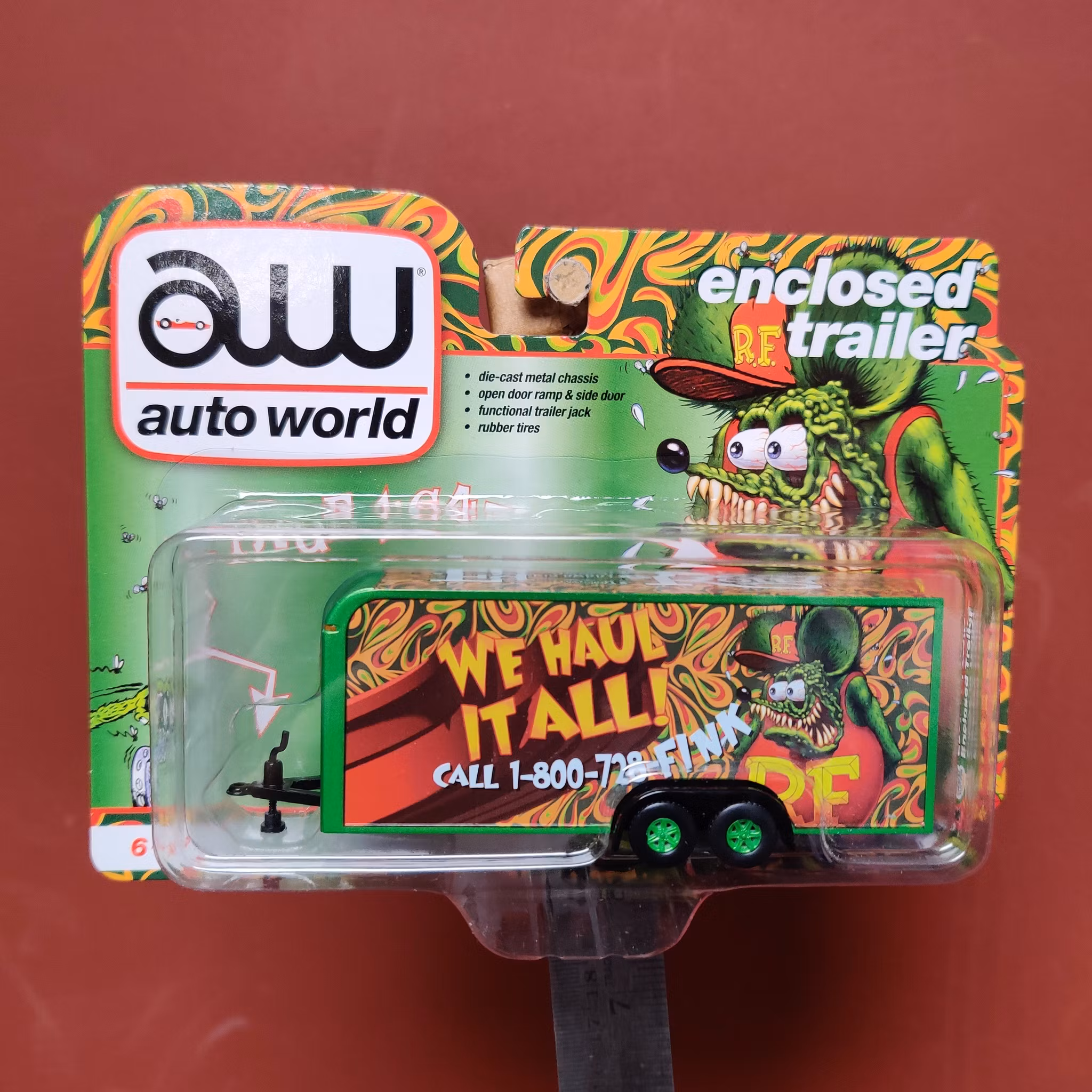Skala 1/64 - Stängd Bil-Trailer, "We Haul It All Rat Fink" från Auto World