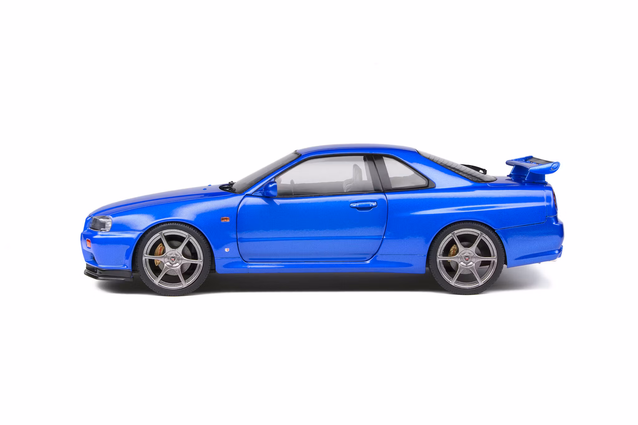 Skala 1/18 NISSAN SKYLINE GT-R (R34) – BAYSIDE BLUE – 1999 fr Solido