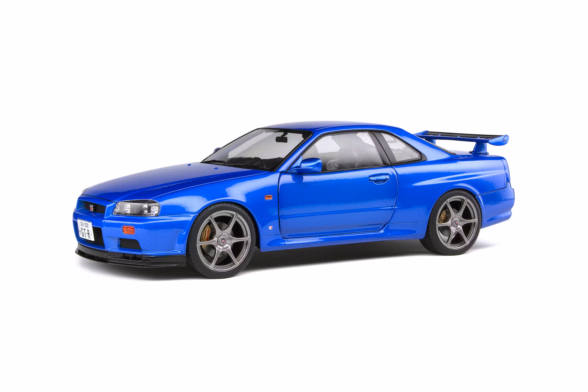 Skala 1/18 NISSAN SKYLINE GT-R (R34) – BAYSIDE BLUE – 1999 fr Solido