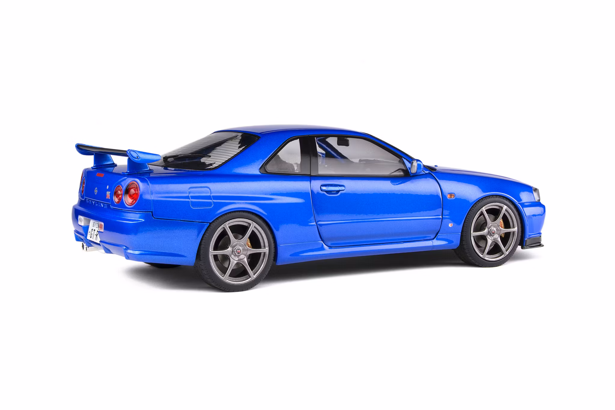 Skala 1/18 NISSAN SKYLINE GT-R (R34) – BAYSIDE BLUE – 1999 fr Solido