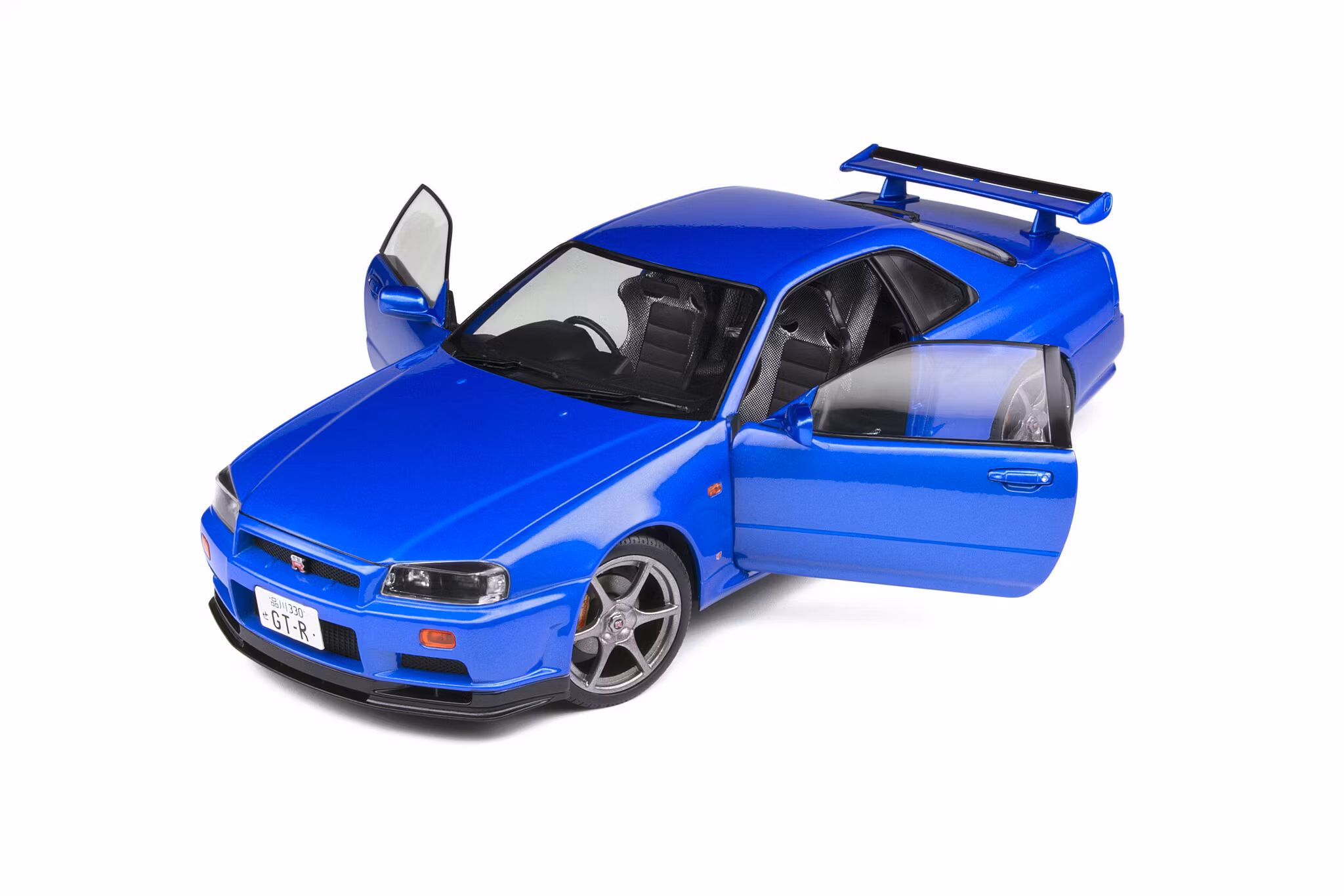 Skala 1/18 NISSAN SKYLINE GT-R (R34) – BAYSIDE BLUE – 1999 fr Solido