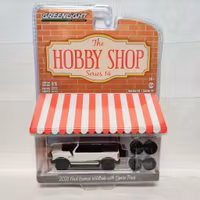 Skala 1/64 Ford Bronco 21' m ext 4x däck & fälg "The hobby shop" fr Greenlight
