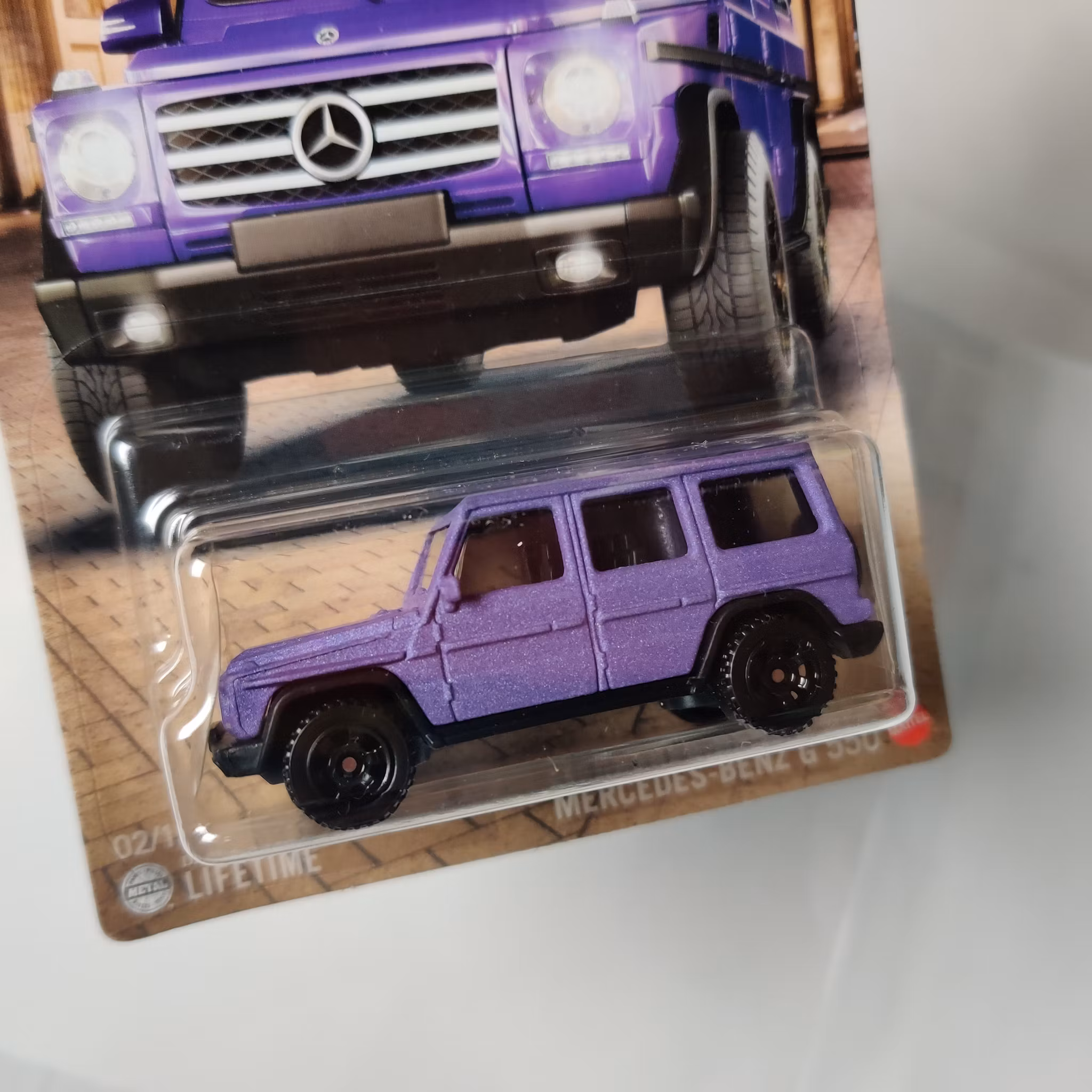 Skala 1/64 MATCHBOX - Germany - Mercedes-Benz G 550 - Lila matt