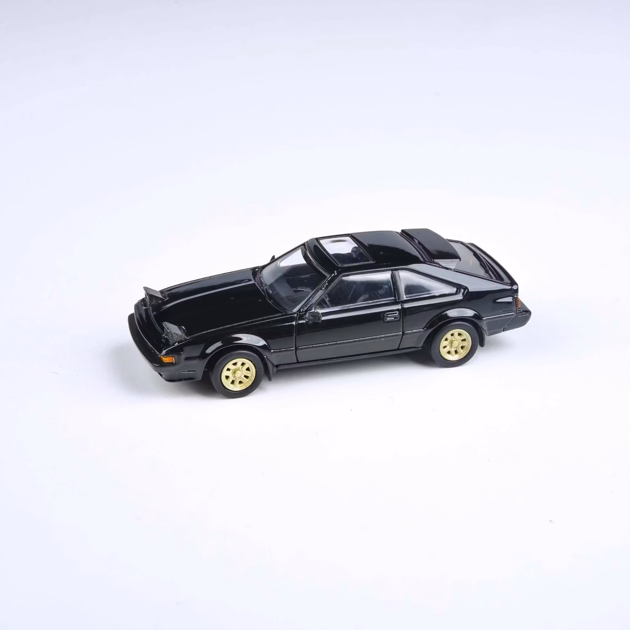 Skala 1/64 1984 Toyota Celica Supra XX Black, Lights up fr Para64