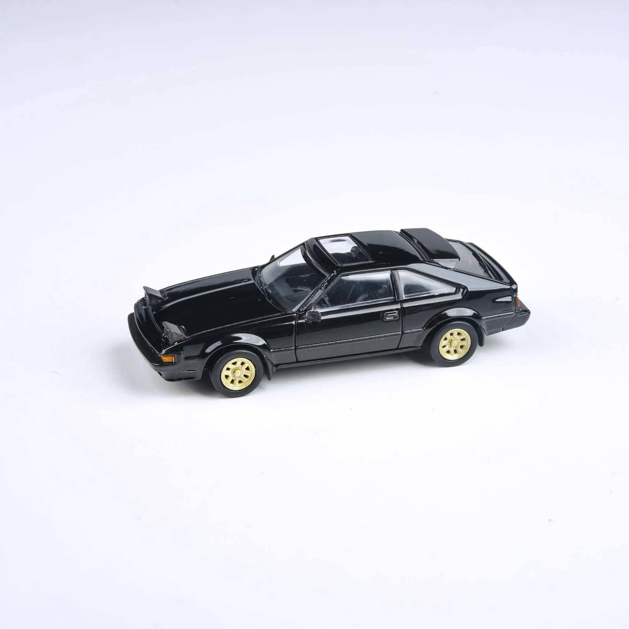 Skala 1/64 1984 Toyota Celica Supra XX Black, Lights up fr Para64
