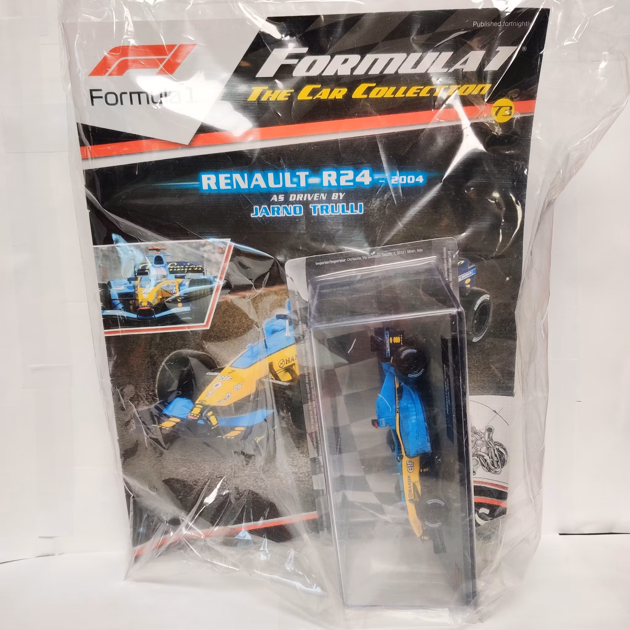 Skala 1/43 Formula 1, Renault R24, 2004, Jarno Trulli m/w tidning/booklet