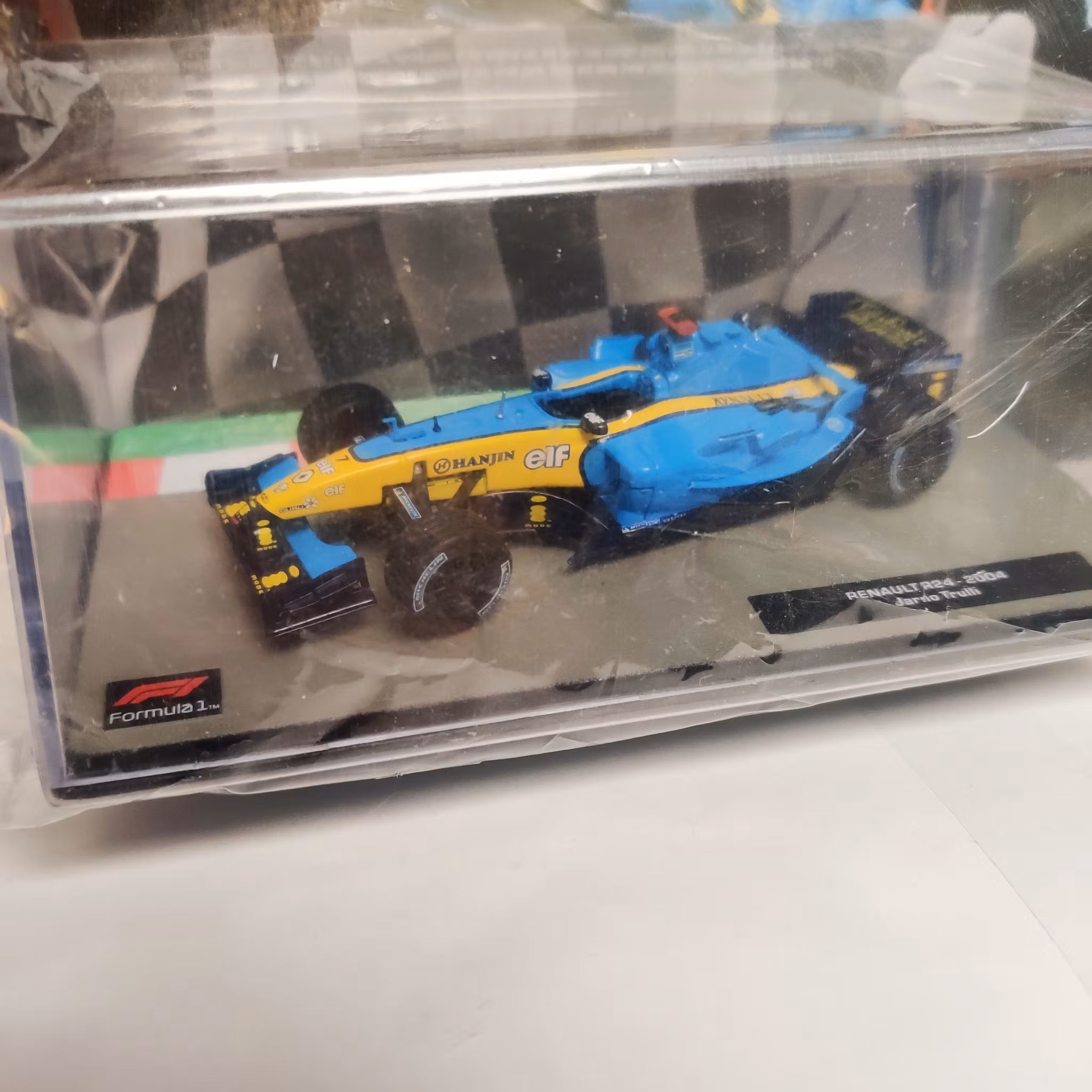 Skala 1/43 Formula 1, Renault R24, 2004, Jarno Trulli m/w tidning/booklet