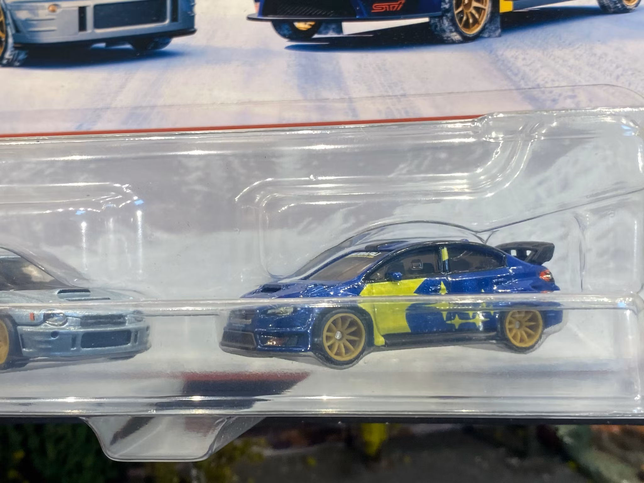 Skala 1/64 Hot Wheels PREMIUM 2-pack: Subaru Impreza WRX & WEX STI 16