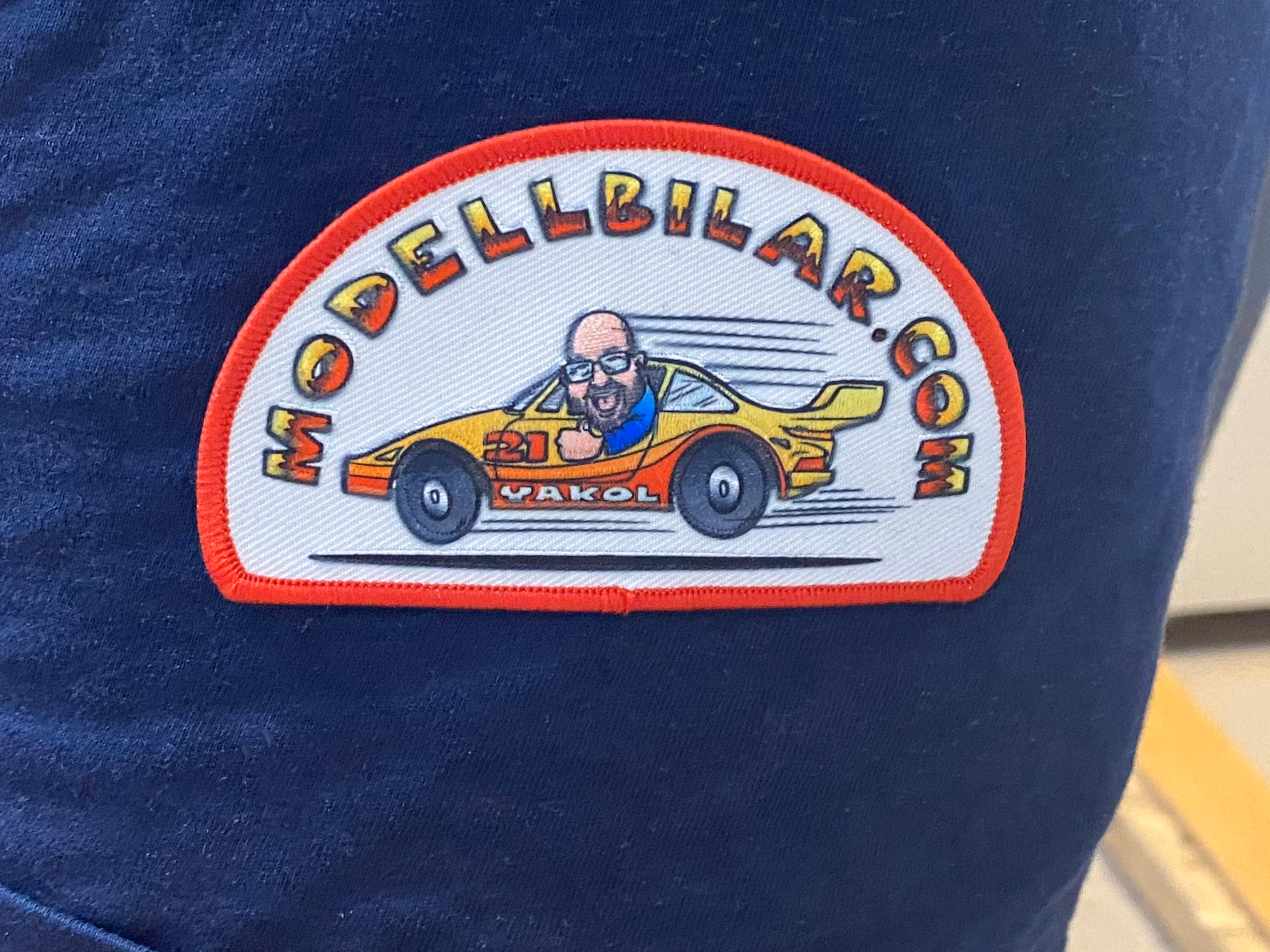 Merchandise: "Modellbilar.com" 95x57 mm for clothes and caps