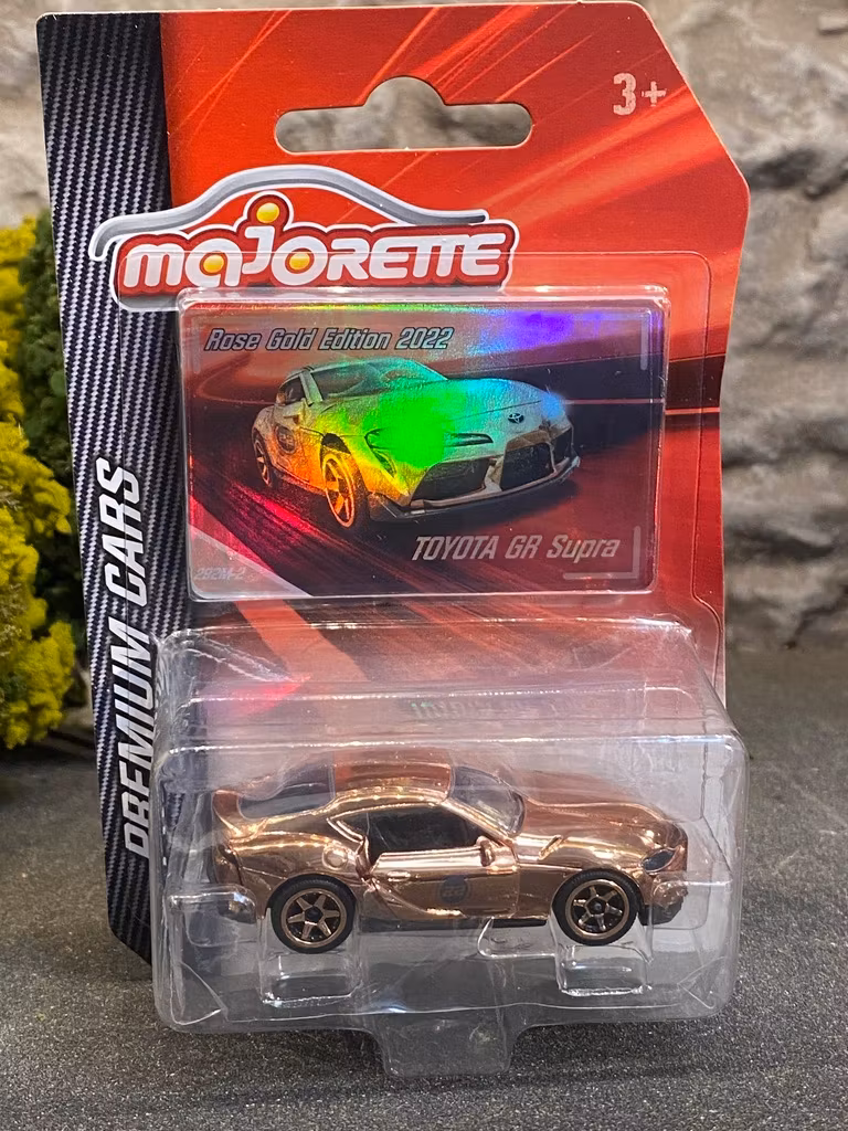 Skala 1/64 fr Majorette - Premium Cars: Toyota GR Supra Rose Gold Ed. 2022