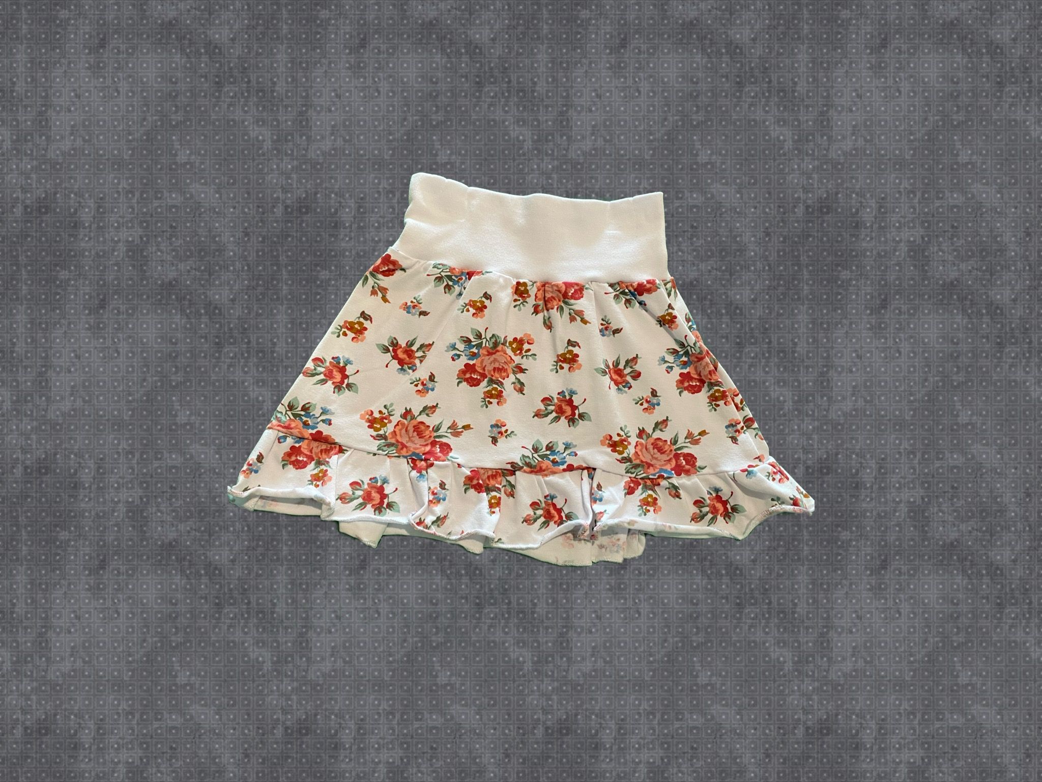Kjol med volang, aprikosa blommor.