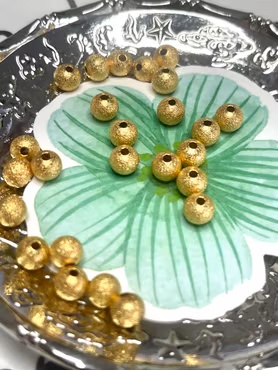 Mellandelar stardust av mässing guld 4 mm (50st)