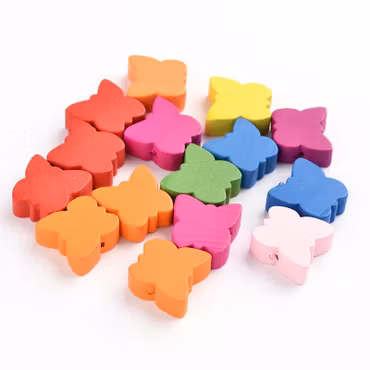 Fjärilar av trä i färgglada färger 16mm 50st