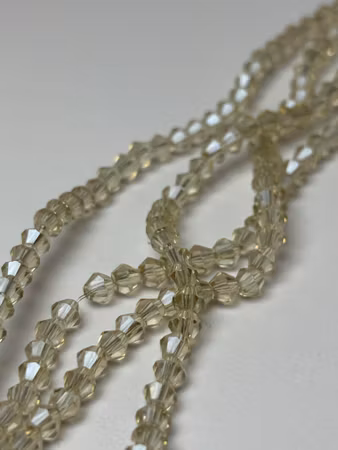 Sträng biconeslipade glaspärlor, Champange 4mm (ca 85st)
