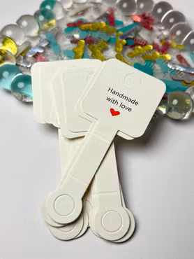 Vit display med klisterlapp att fästa runt produkter för hängning (20st)