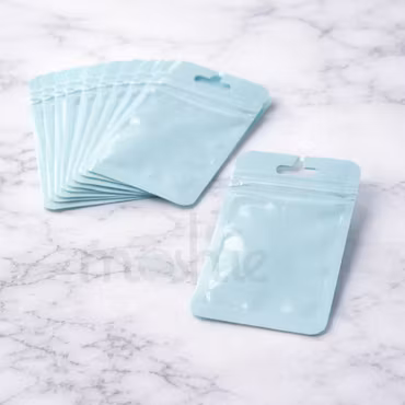 Zippåsar i pastellblå blixtlåspåse 10x7cm 10st