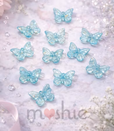 Fjärilar i glas ljusblå med golddust 11mm 20st