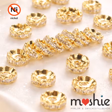 Strassrondeller nickelfria 10mm vågiga guld 10st