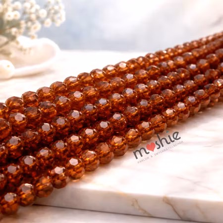 Fasetterade transparenta bruna glasrondeller på sträng 4x3mm 90st